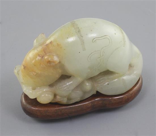 A Chinese pale celadon and russet jade figure of a tree shrew or squirrel, 18th / 19th century, 6.6cm, tiny chips, later wood stand